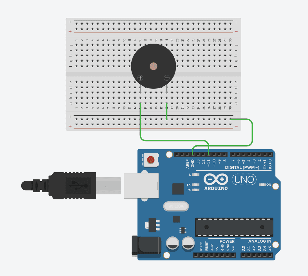 Schematic of an Arduino Uno wired to a Piezo Buzzer